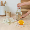 one small square beeswax foodwrap, made with beeswax, tree resin, and organic jojoba oil infused into a hemp and organic cotton cloth.