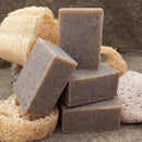 A cool, stimulating scrubby pumice powder foot soap with shredded loofah, peppermint leaves, menthol and an invigorating essential oil blend.