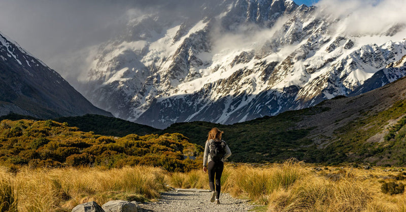 Girl walkin on mountain trail
