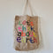 jute beach bag with respect the earth motto. 